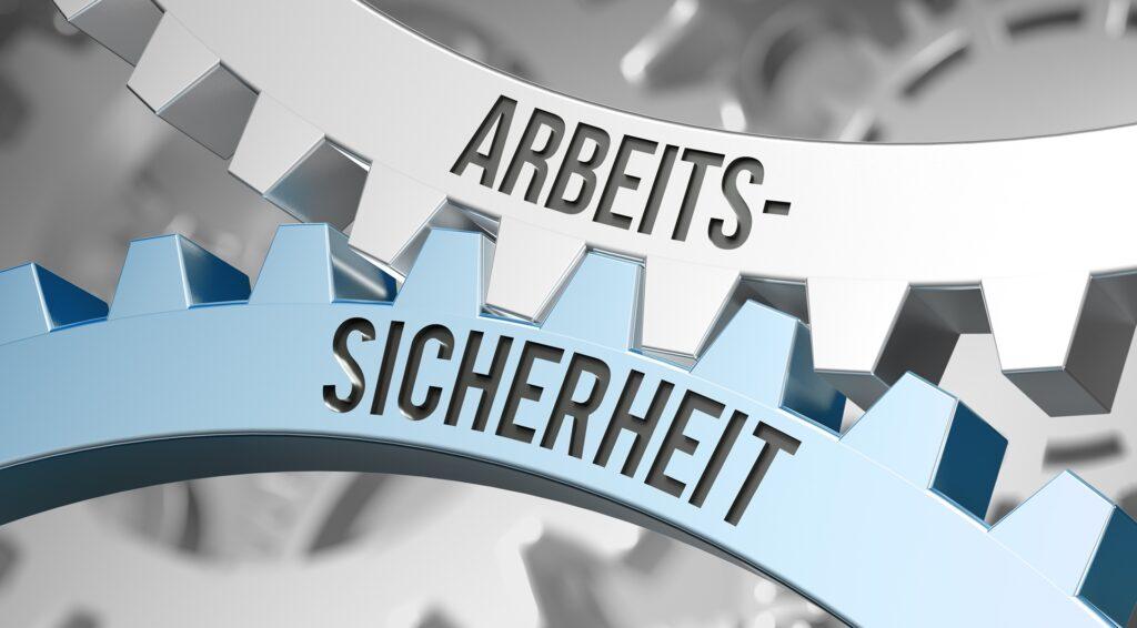 Zahnräder mit Schriftzug Arbeitssicherheit | Arbeitsbühne mieten